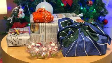 gifts on a table wrapped in newspaper