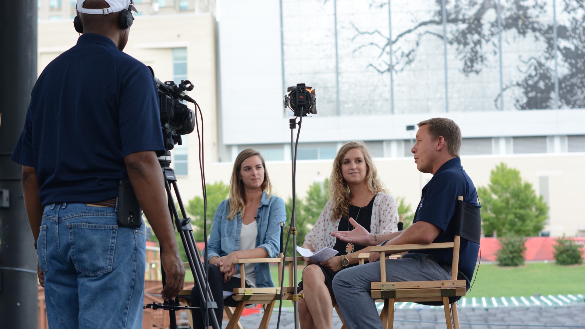 communicators interviewing on a stage