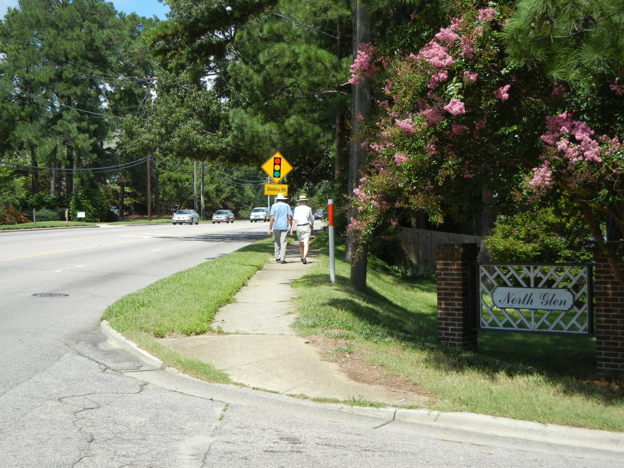 People walking on Six Forks Road 