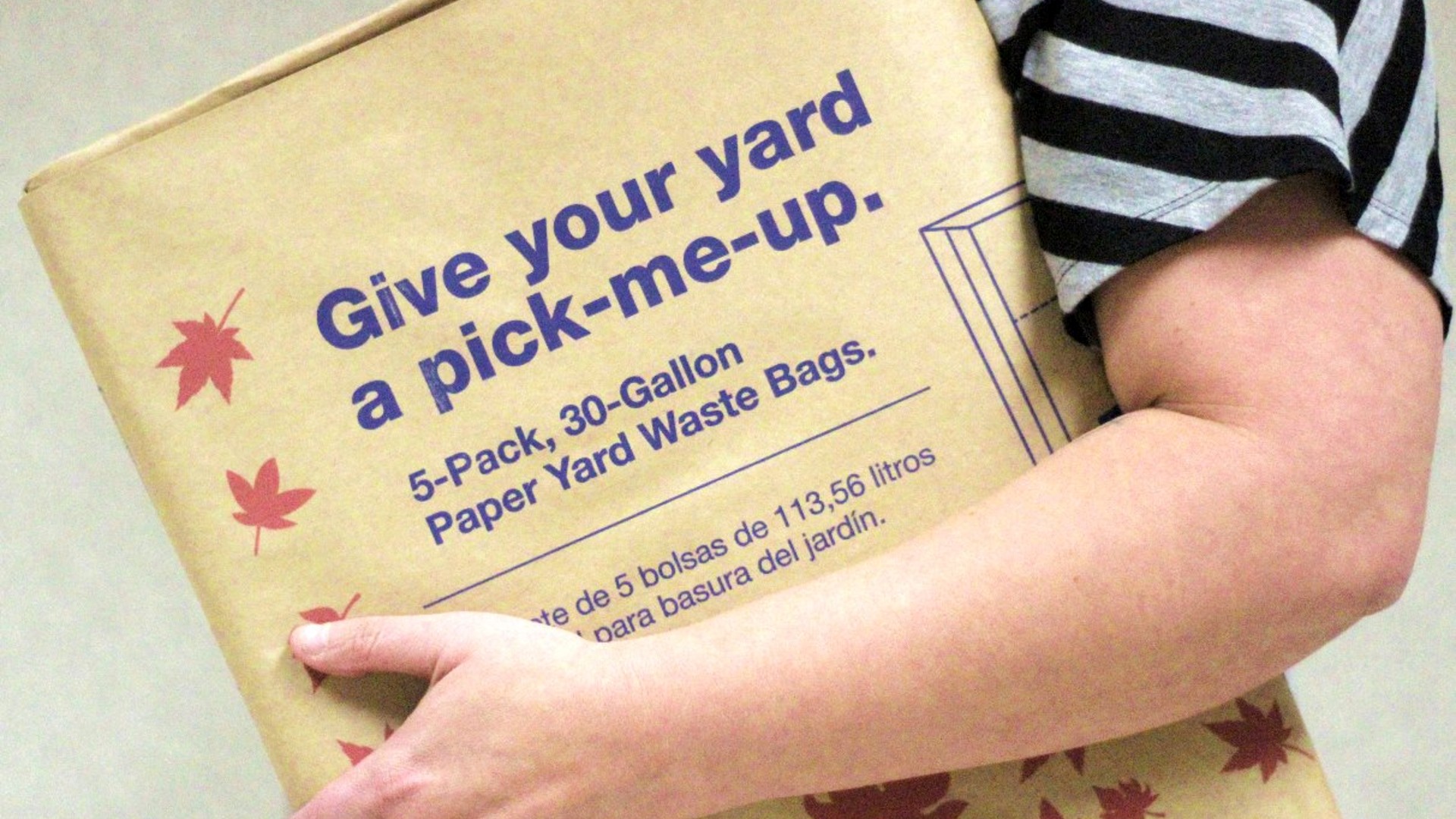 sideview of biodegradable bag that looks like a large brown paper bag with instructions
