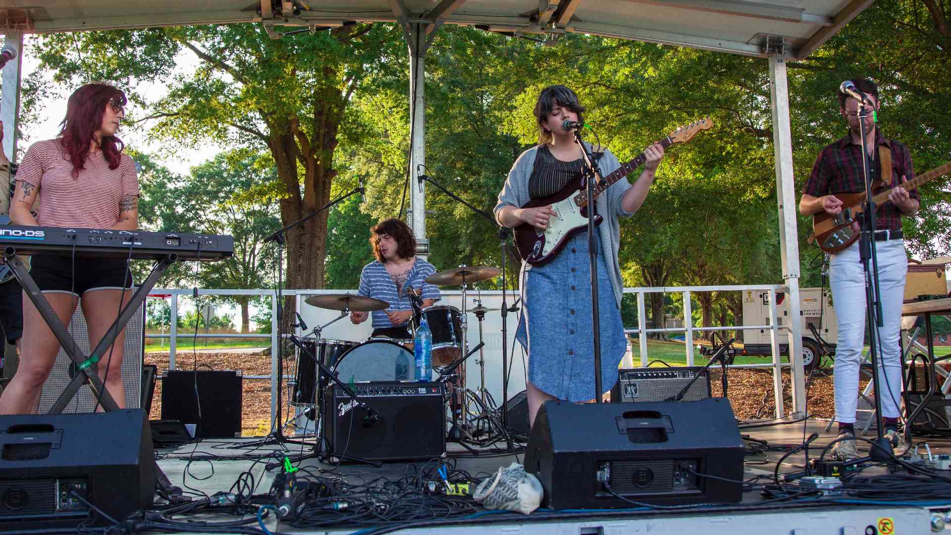 A band plays at an outdoor venue