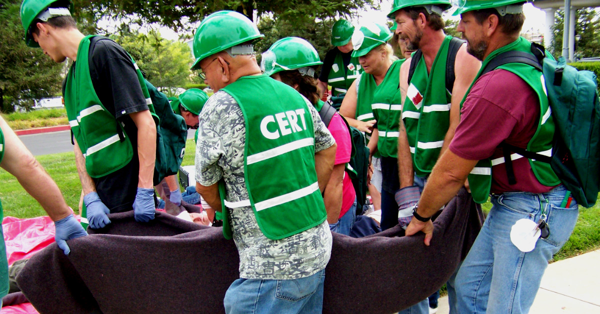 Emergency volunteers carrying supplies