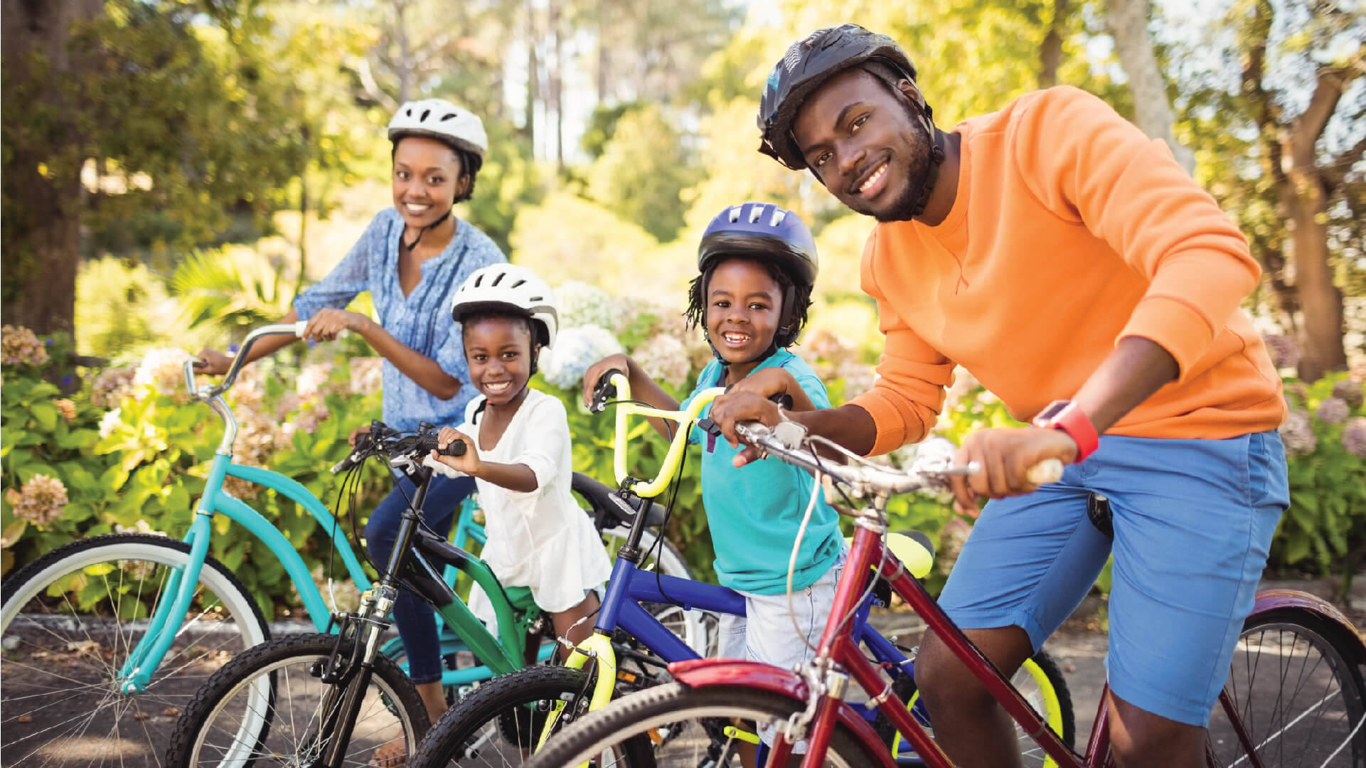 Family of four riding bicycles