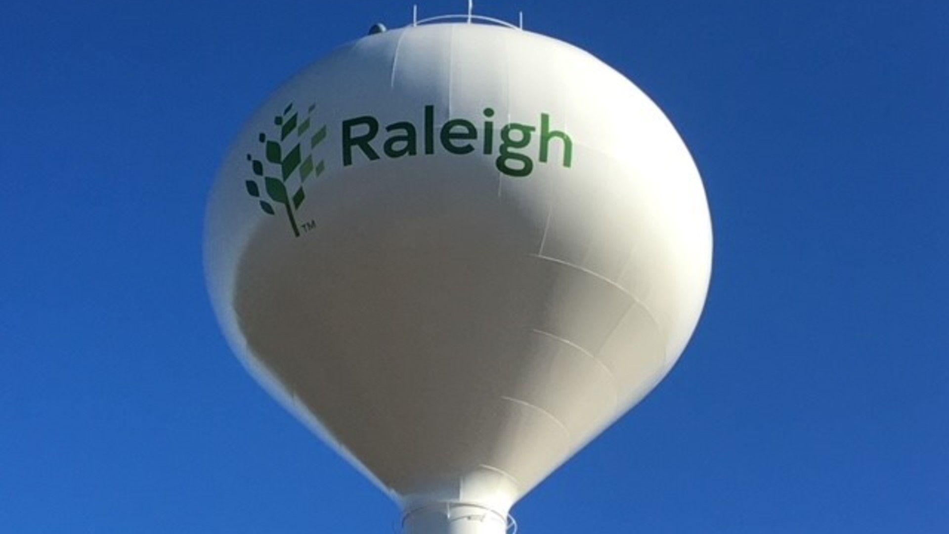 Drone picture of City of Raleigh branded water tower.