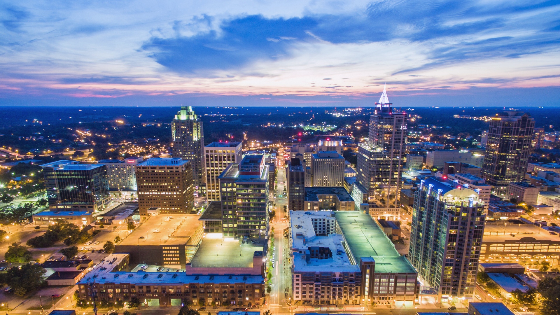 Aerial view of Raleigh skyline at dusk