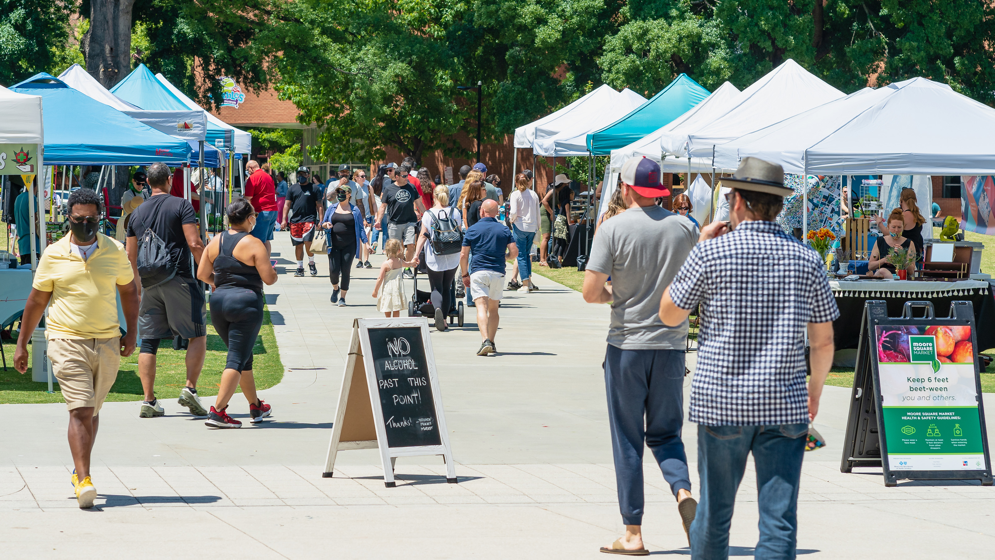 People visiting event tables