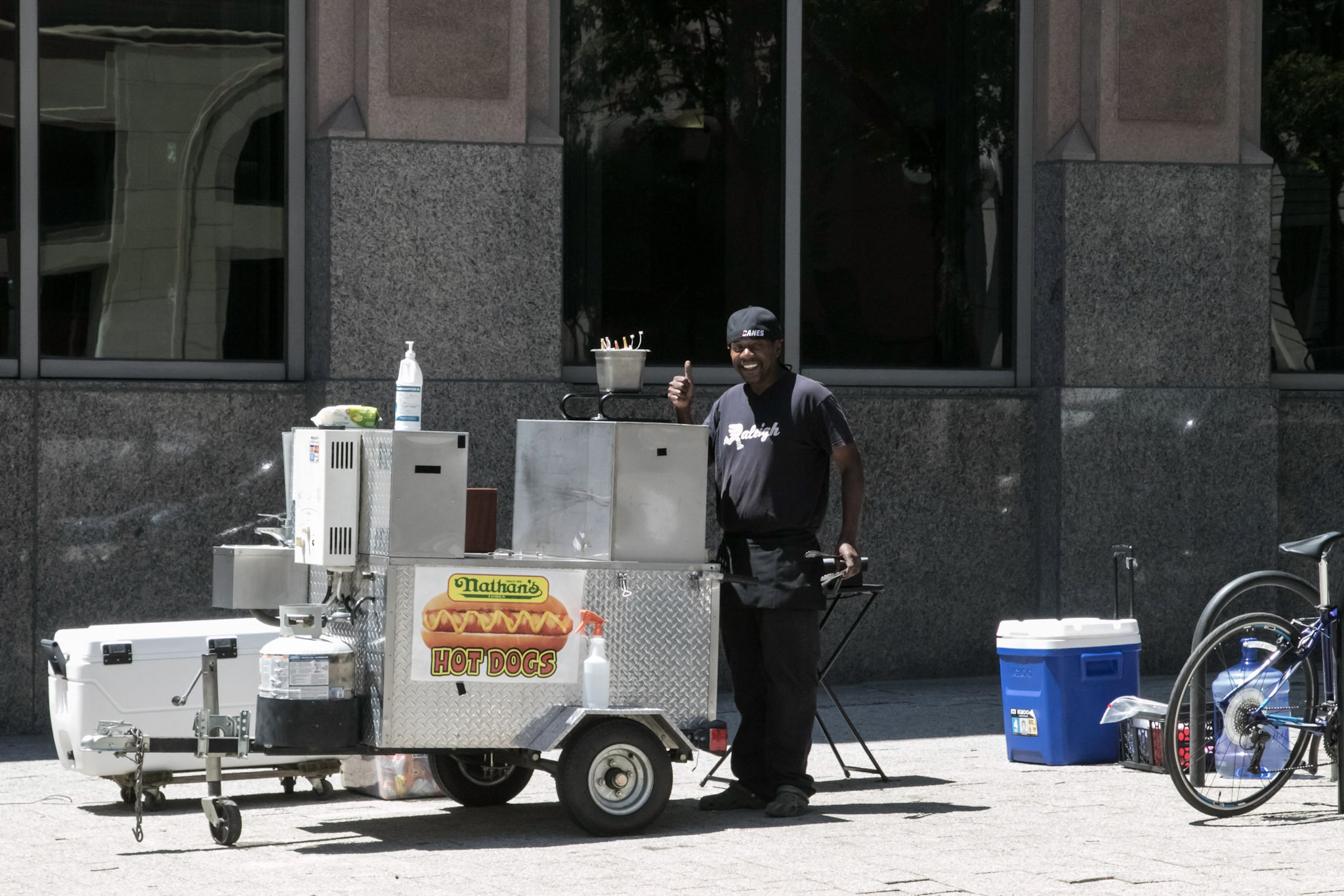 pushcart vendor giving a thumbs up in downtown Raleigh