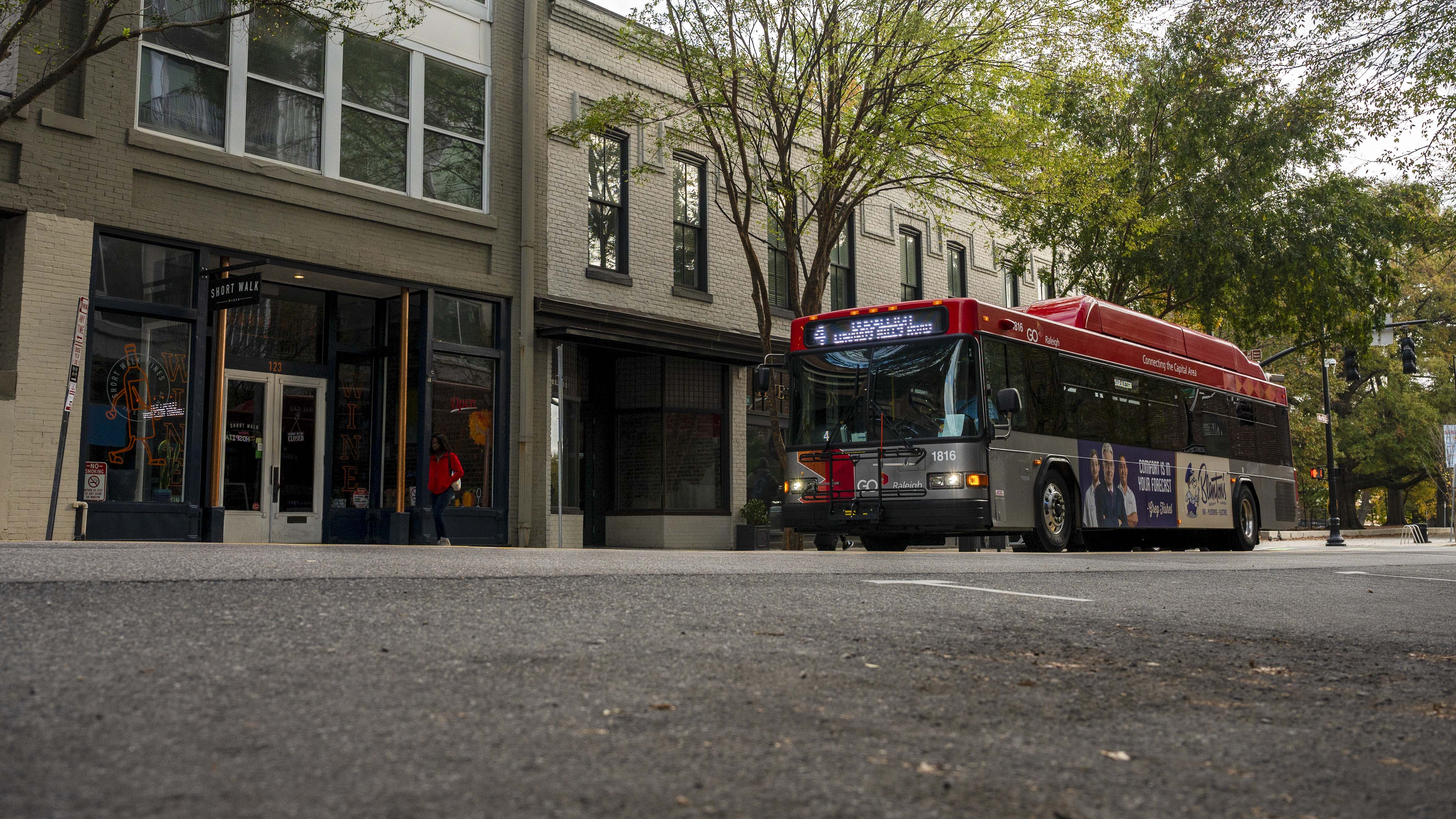 GoRaleigh Bus with Advertisement Heading to GoRaleigh Station