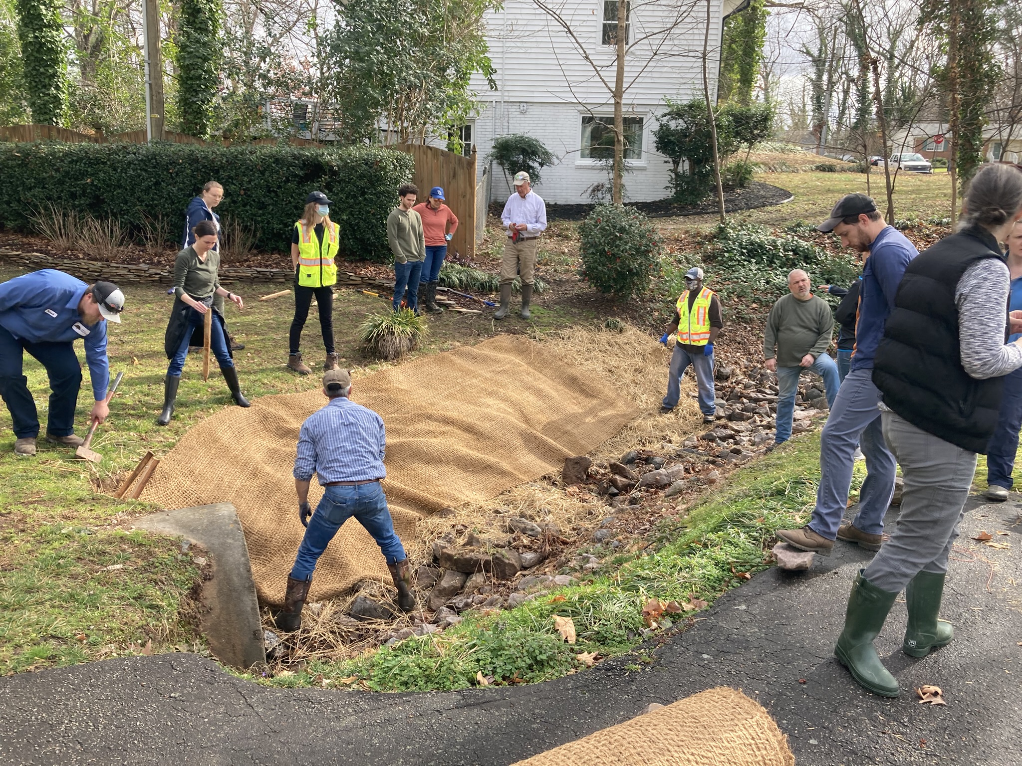 Stormwater staff repairing a stream bank