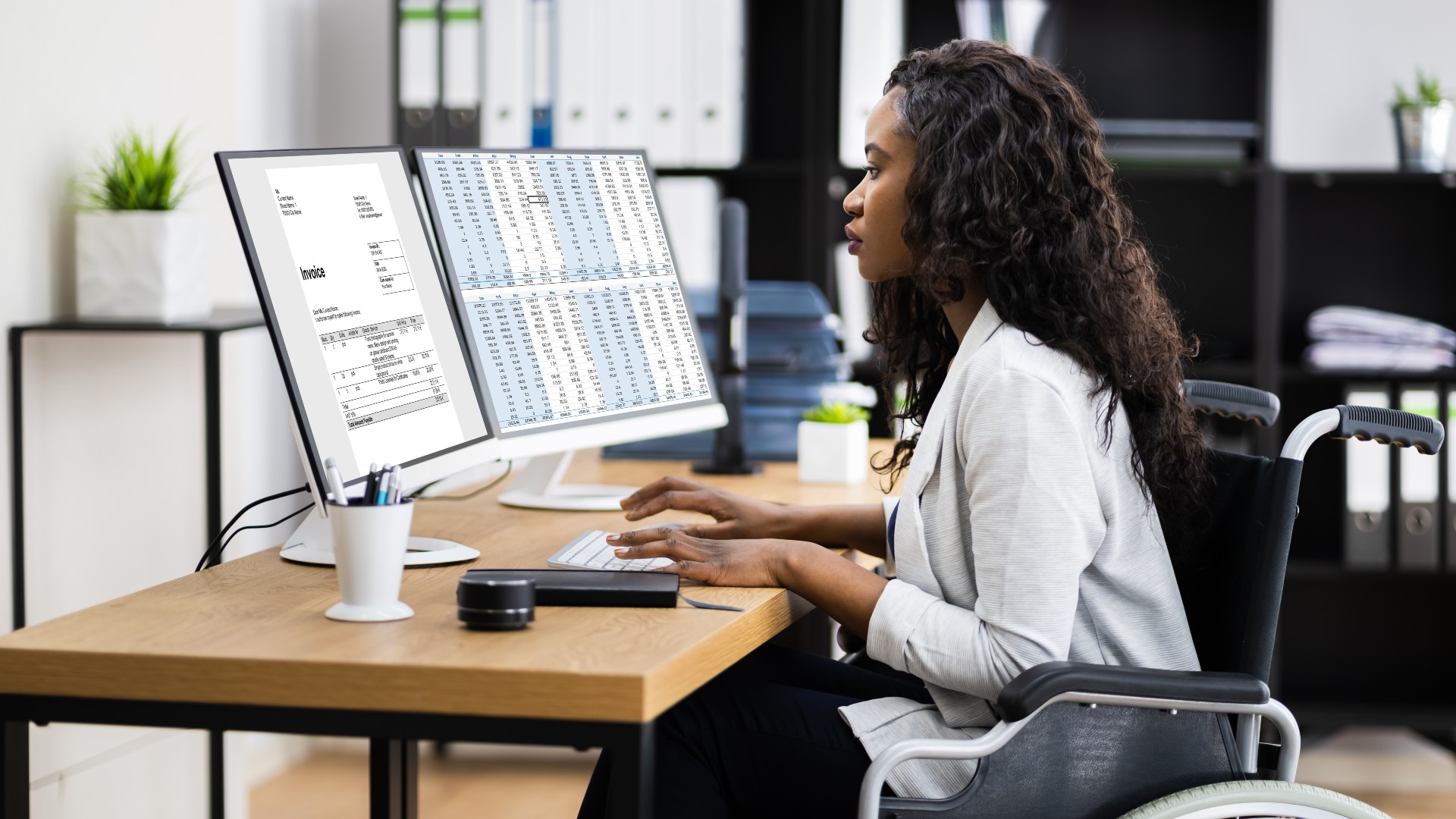 woman in a wheelchair at computer 