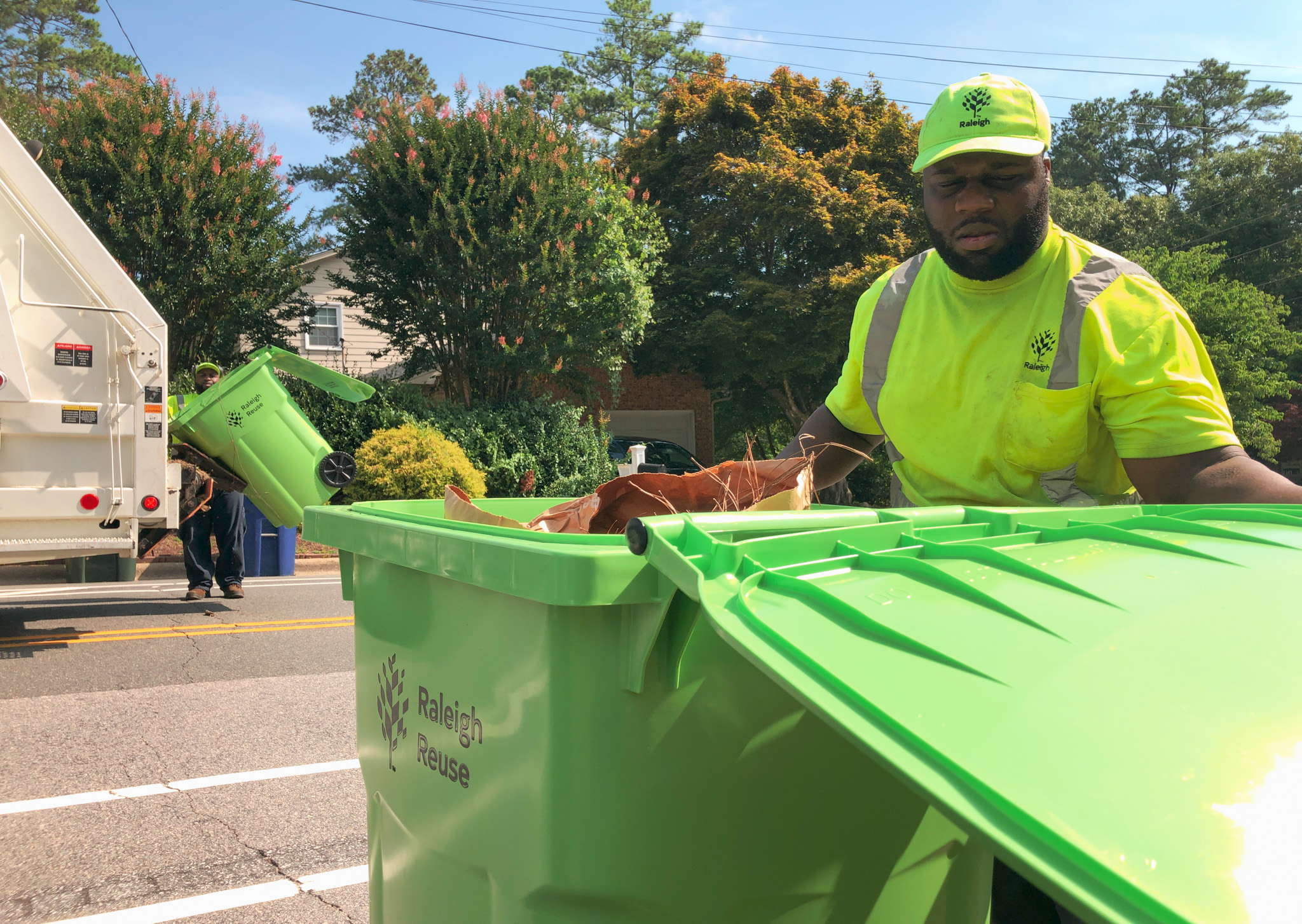 yard waste crews collecting curbside yard waste cart