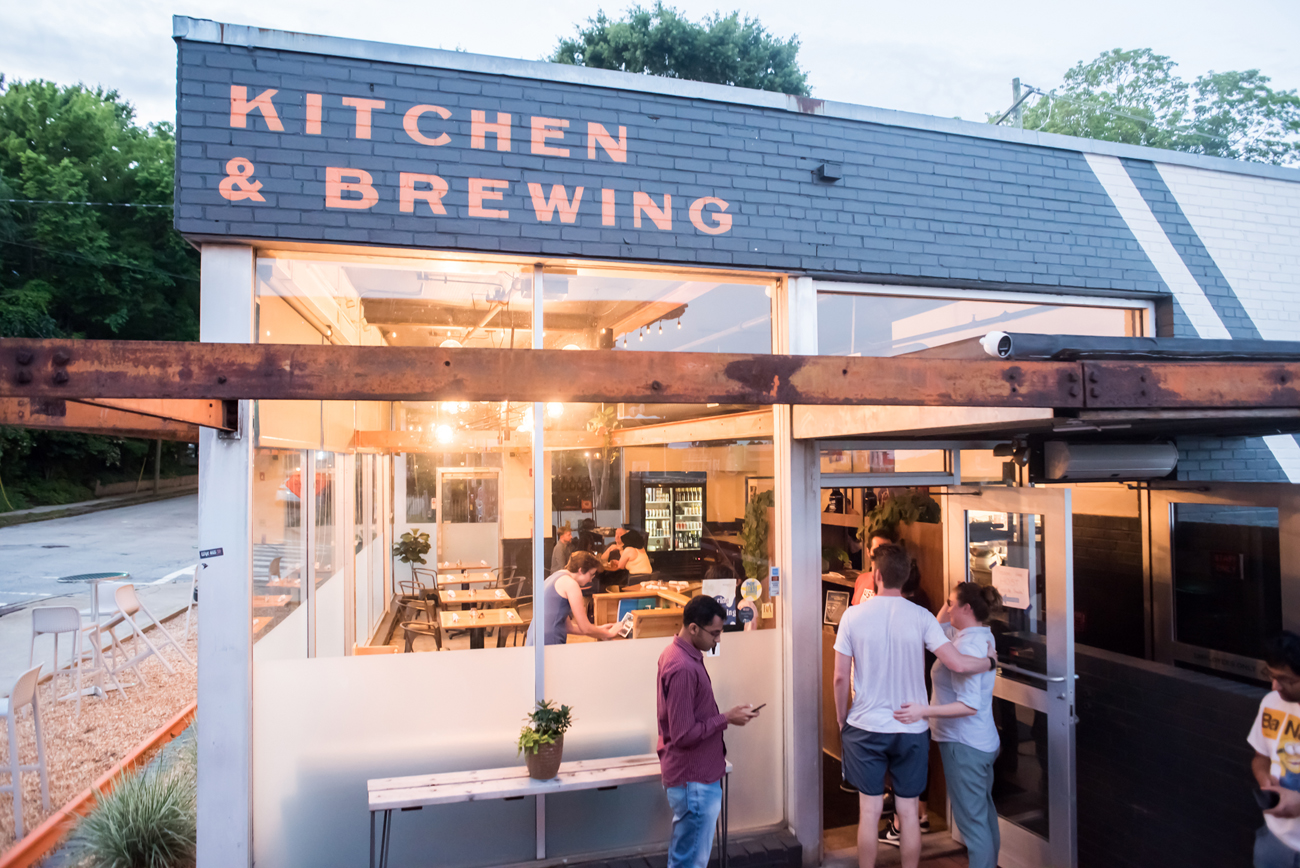 patrons enter wye hill brewing located within downtown Raleigh social district