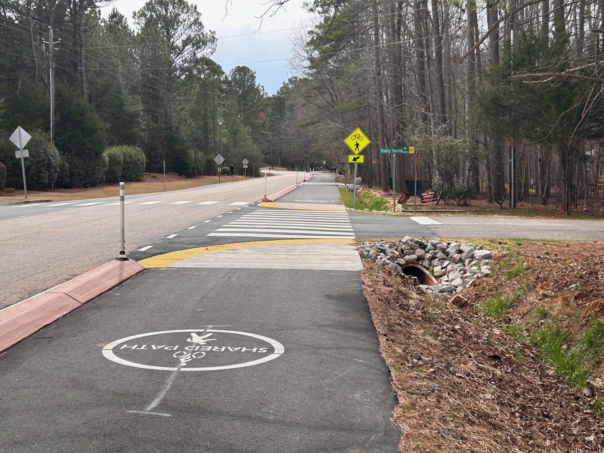 The new multi-use path on Trenton Road. This image is at an intersection and shows the message "share this path".