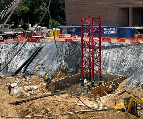 Image of construction site for City Hall with tower crane base 