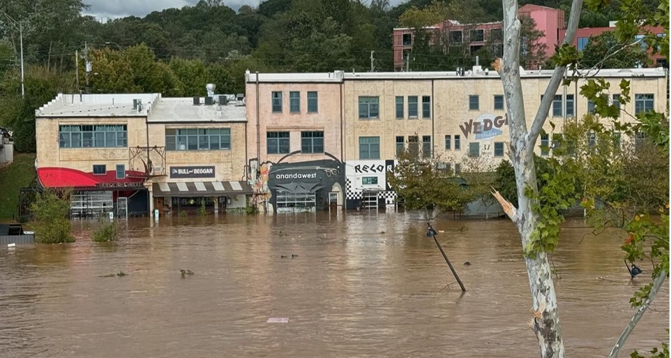 Flooded business district with several store front businesses damaged by water after a hurricane. 