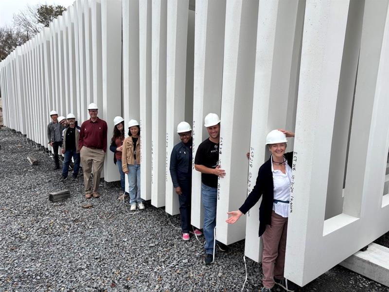 Image shows construction team with some of the panels that will be the shell of Raleigh's new City Hall
