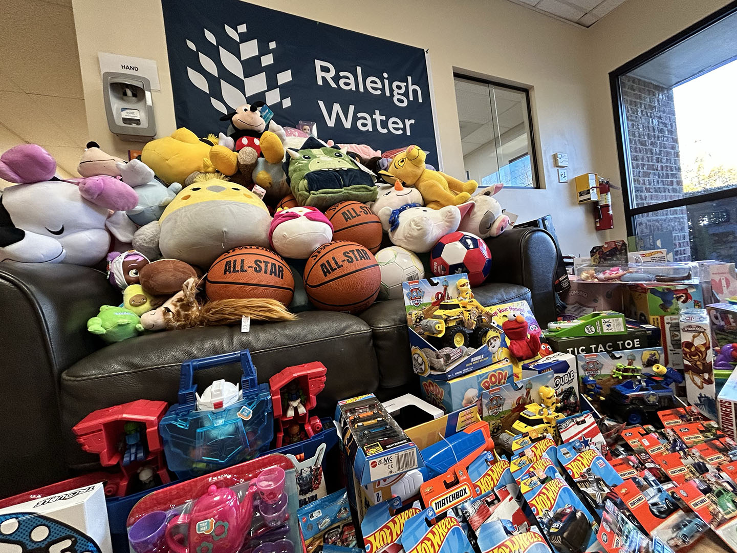 lots of toys on and near a couch