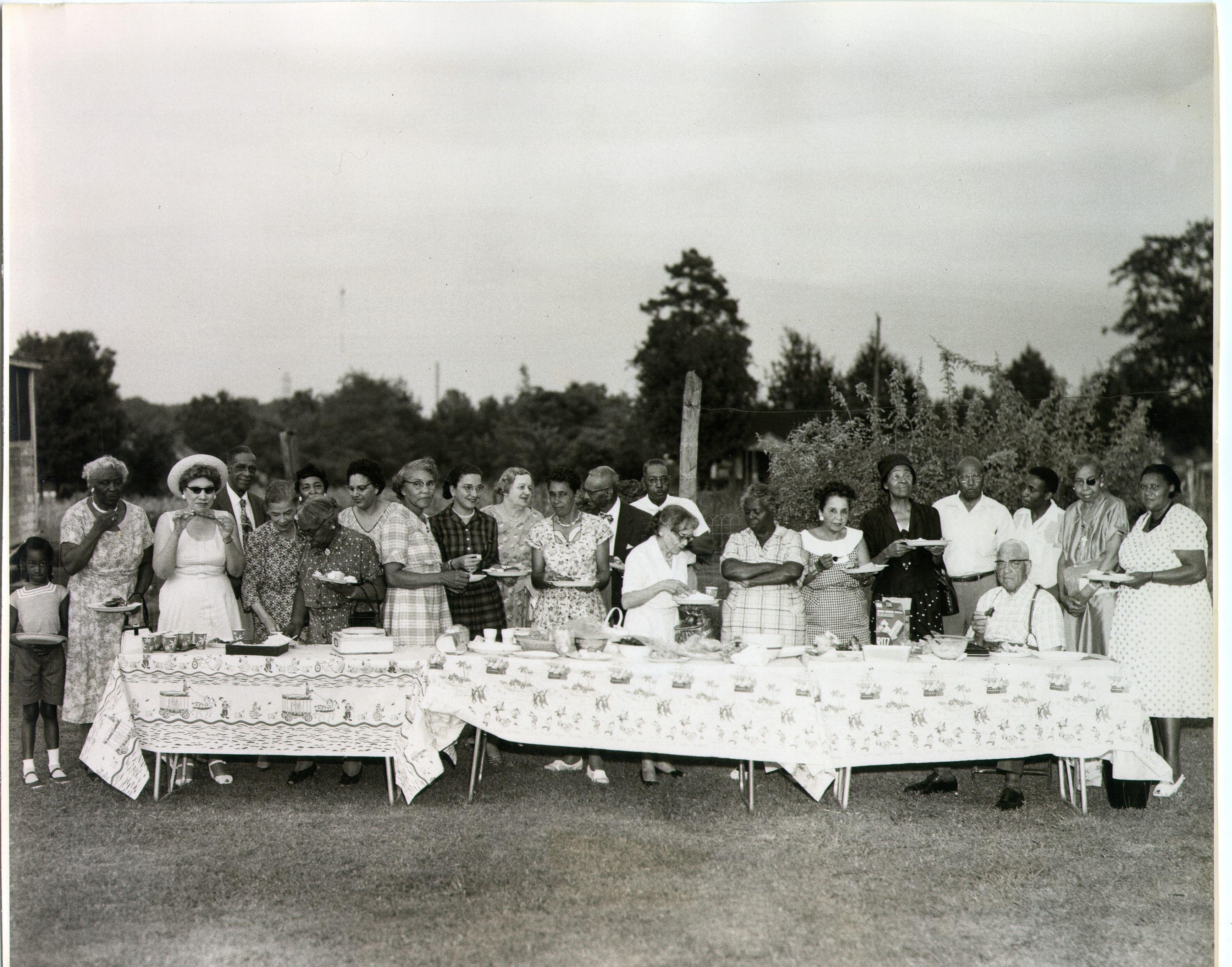 Historic photo of a picnic. Group of individuals in 1958