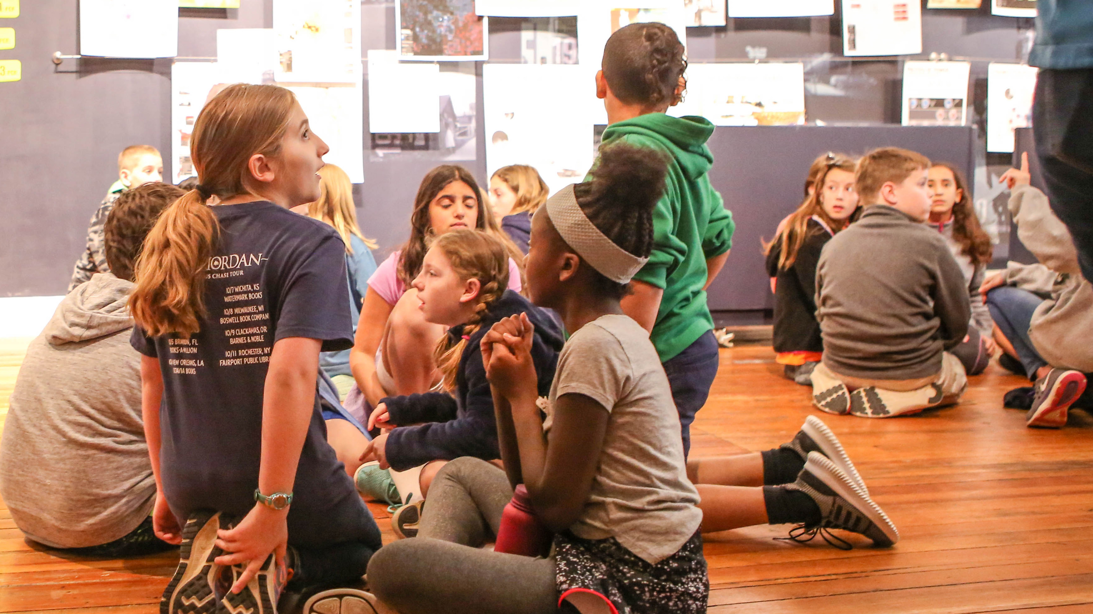 Girls working together on activity at COR Museum