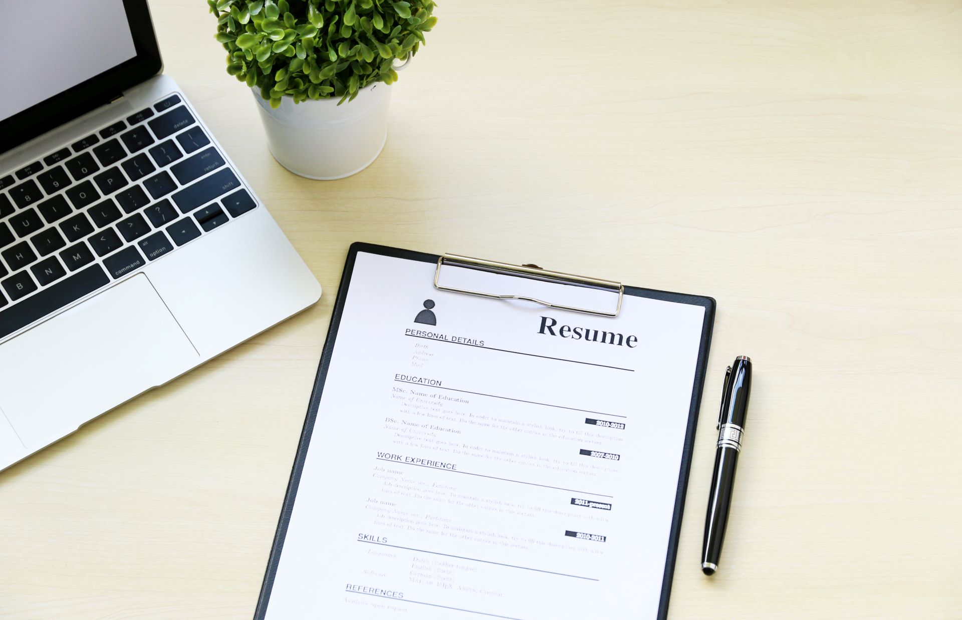 Paper resume placed on work desk