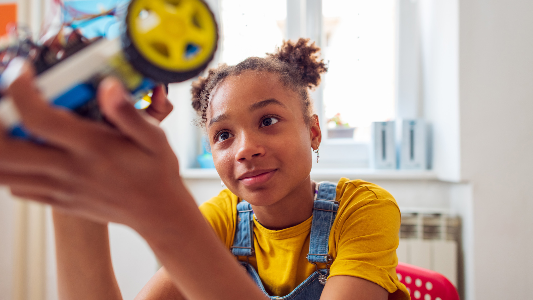 a young person engaged in a STEM learning environment