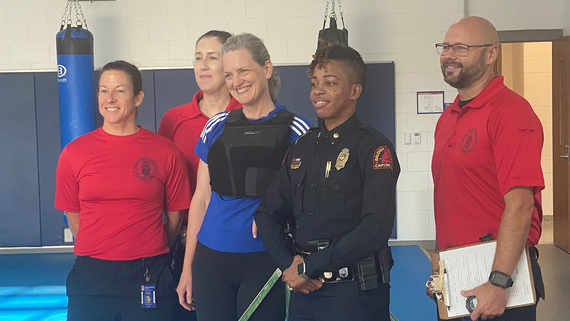 Mayor Cowell stand with RPD fitness test team after completing the training academy test.