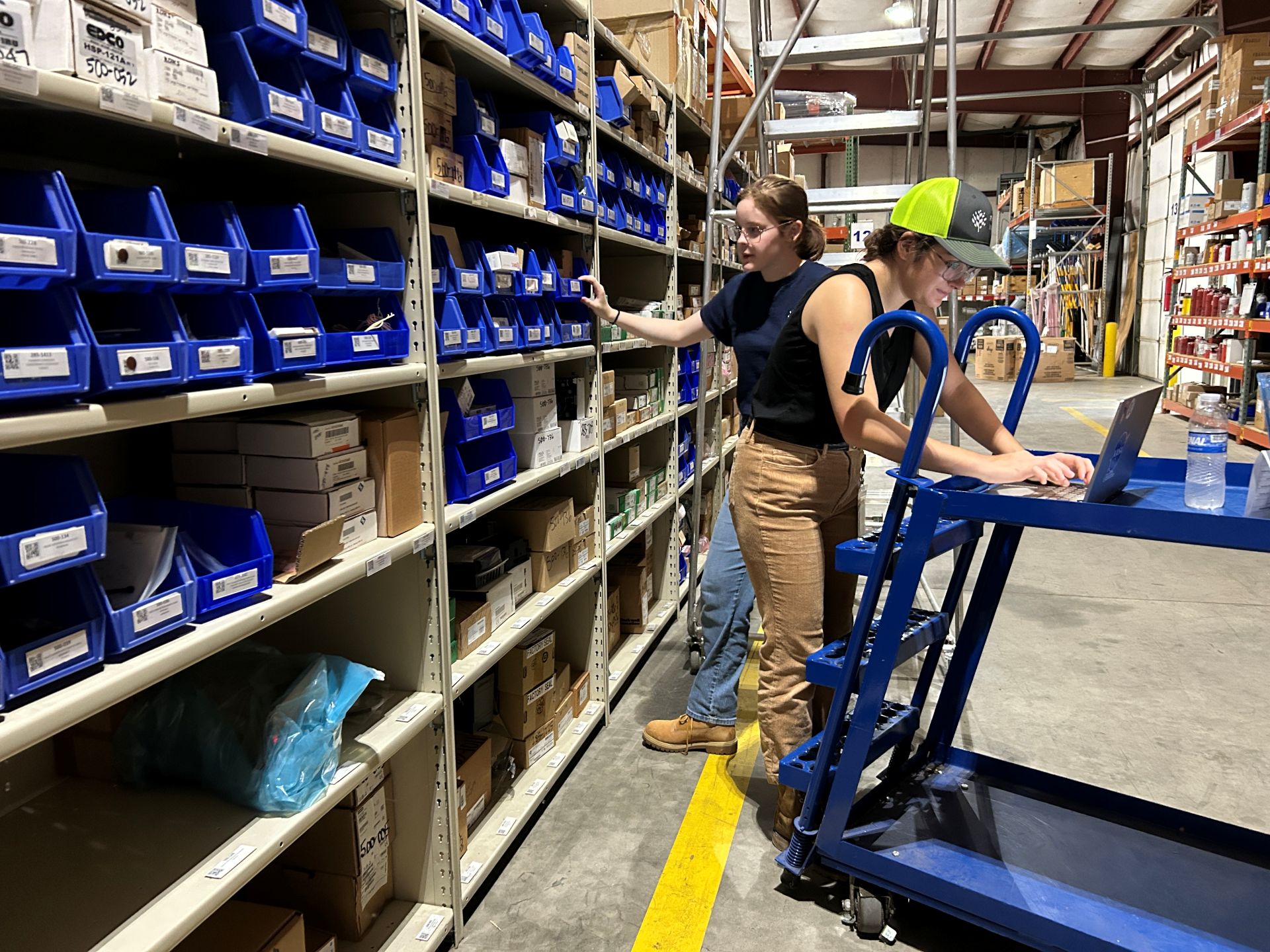 Workers in warehouse logging items
