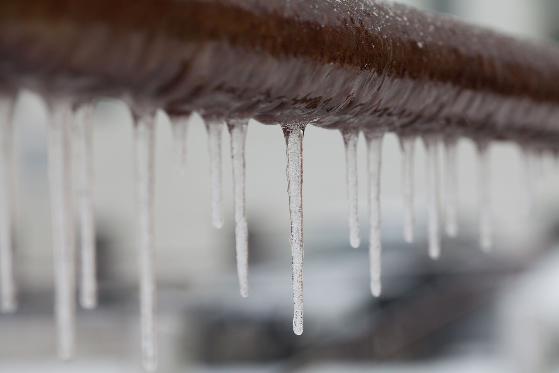 Frozen pipe with icicles hanging off