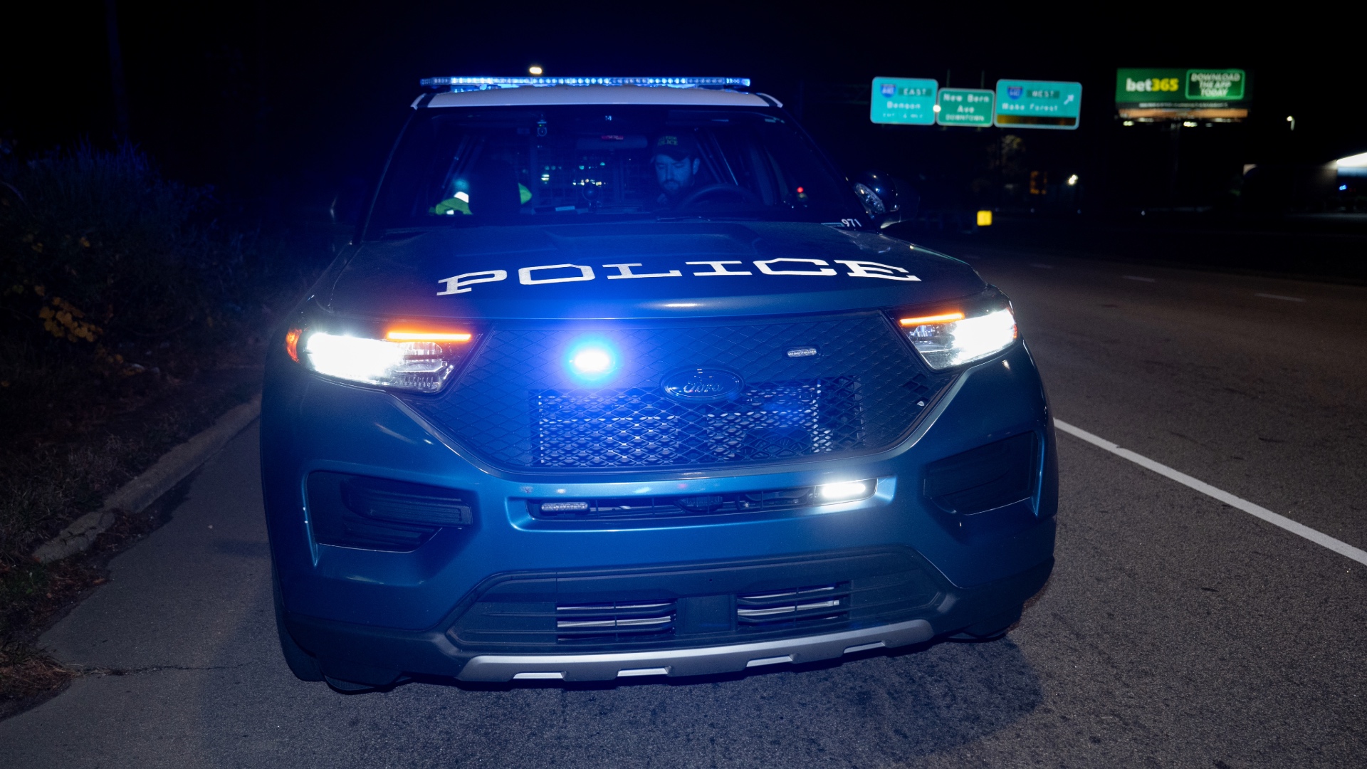 RPD Car at night with sirens flashing