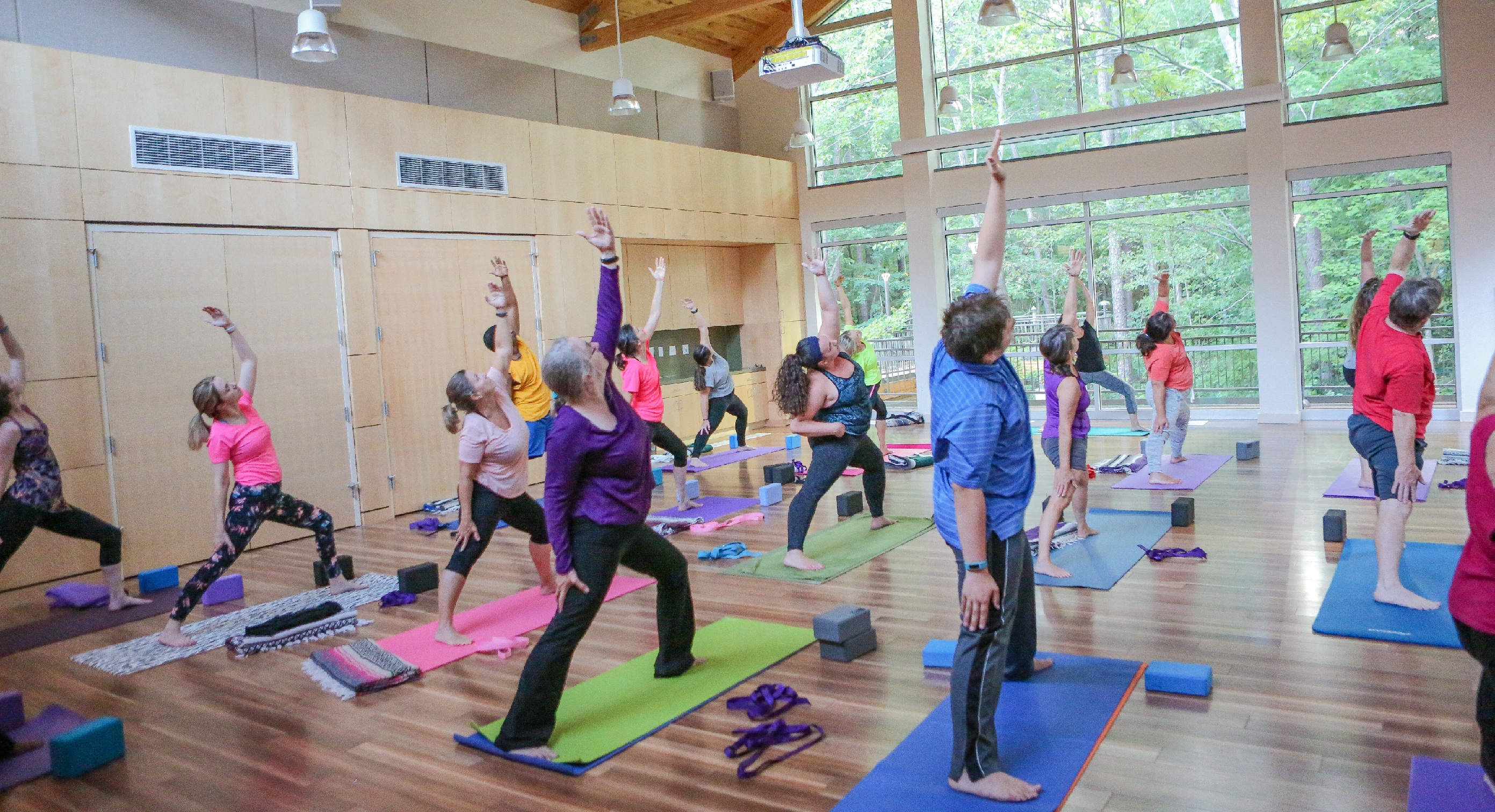 people doing yoga in a community center