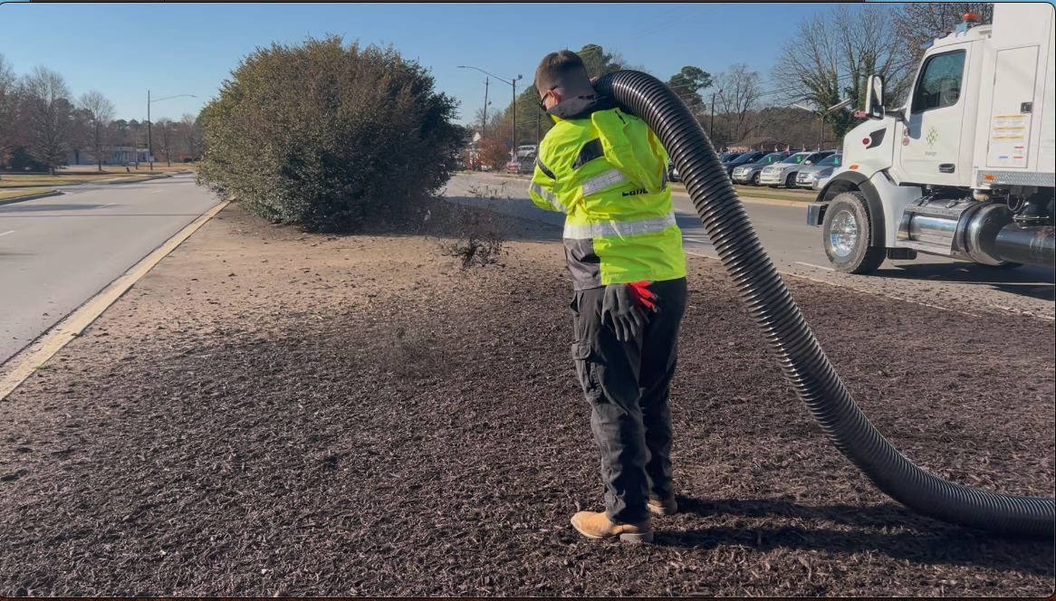 Mulch truck blower at work