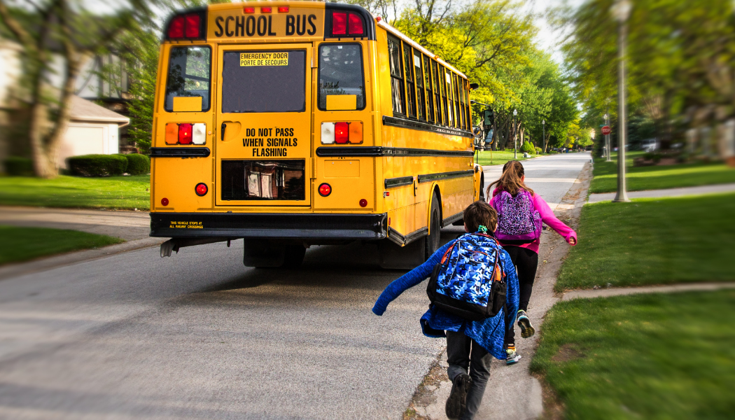 Children catching school bus
