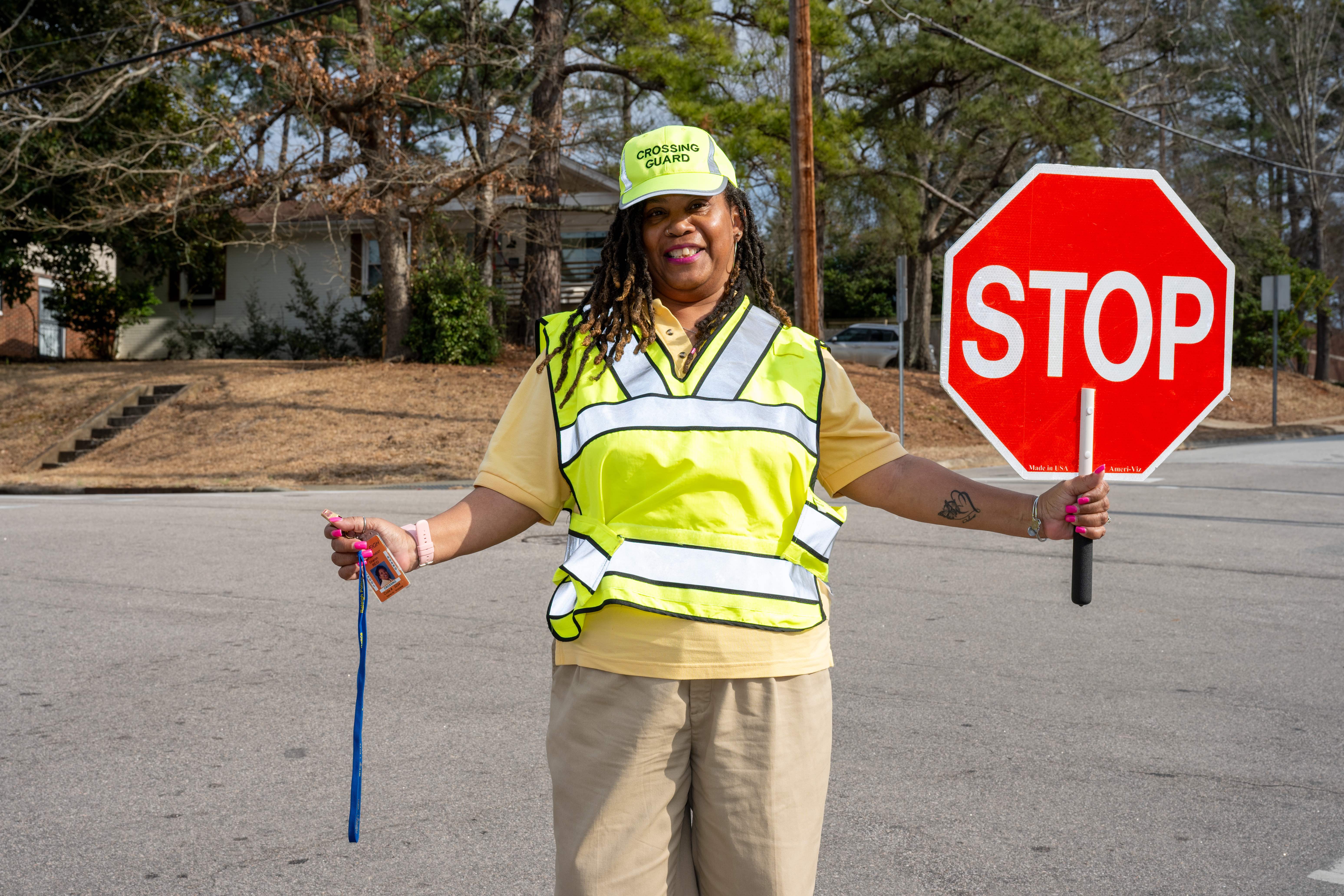School crossing guard holding stop sign