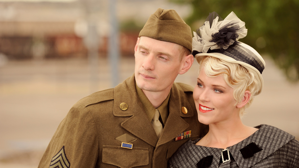 two people in vintage 1940s-style clothing