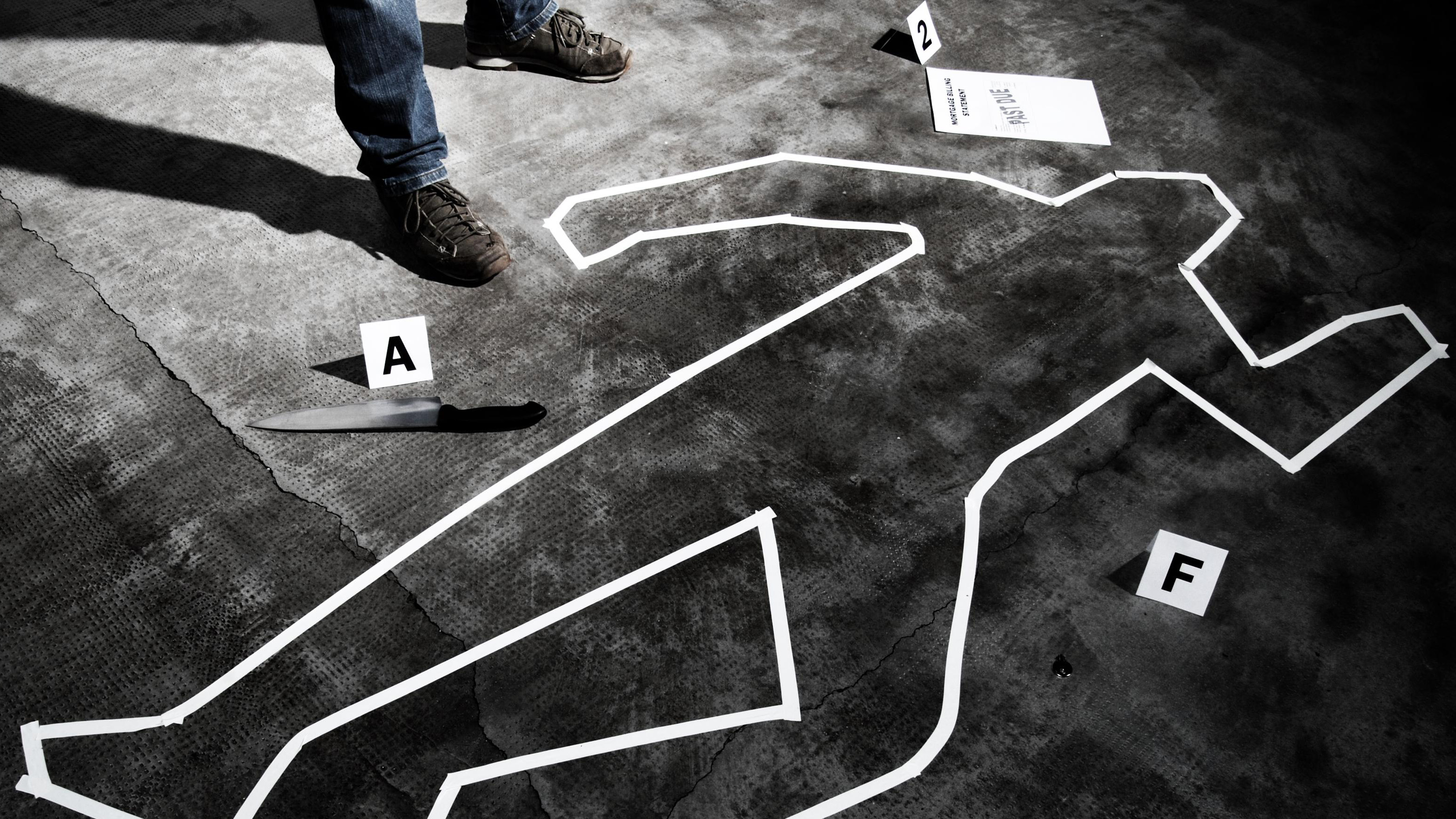 a crime scene with tape on the floor
