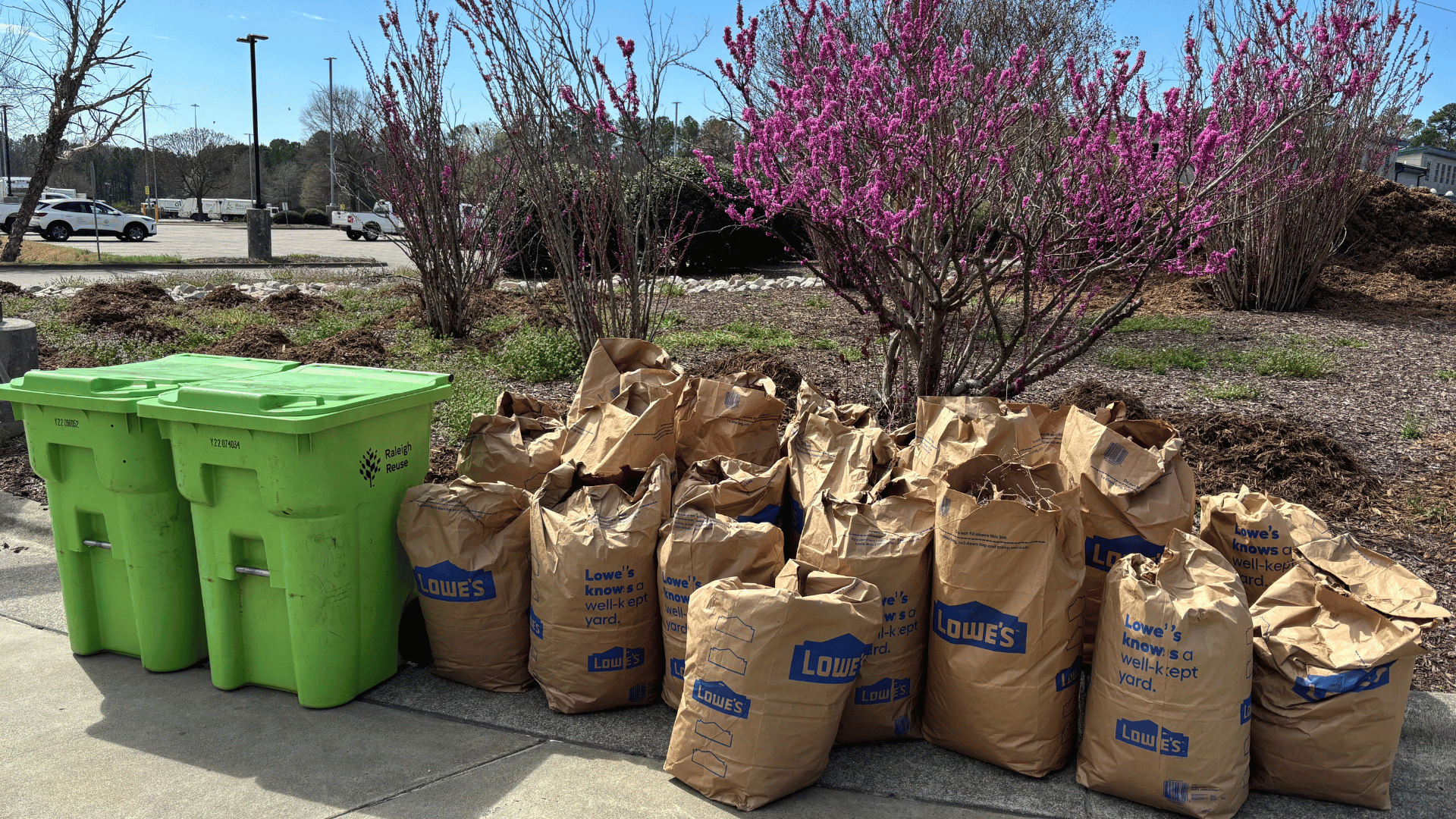 Two yard waste bins and 20 biodegradable yard waste bags sit outside the Wilders Grove Solid Waste Services Facility