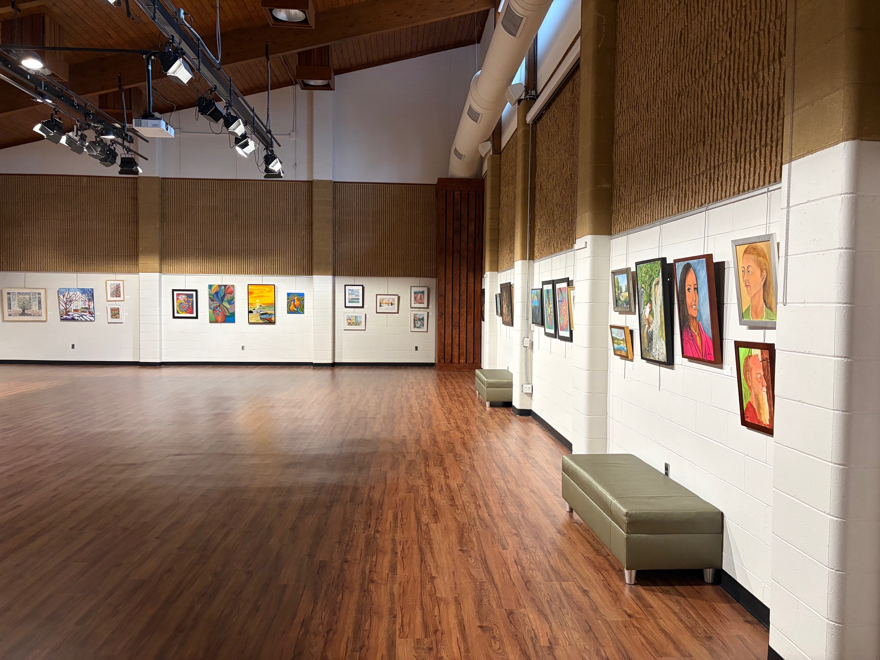 paintings in a variety of mediums on display 