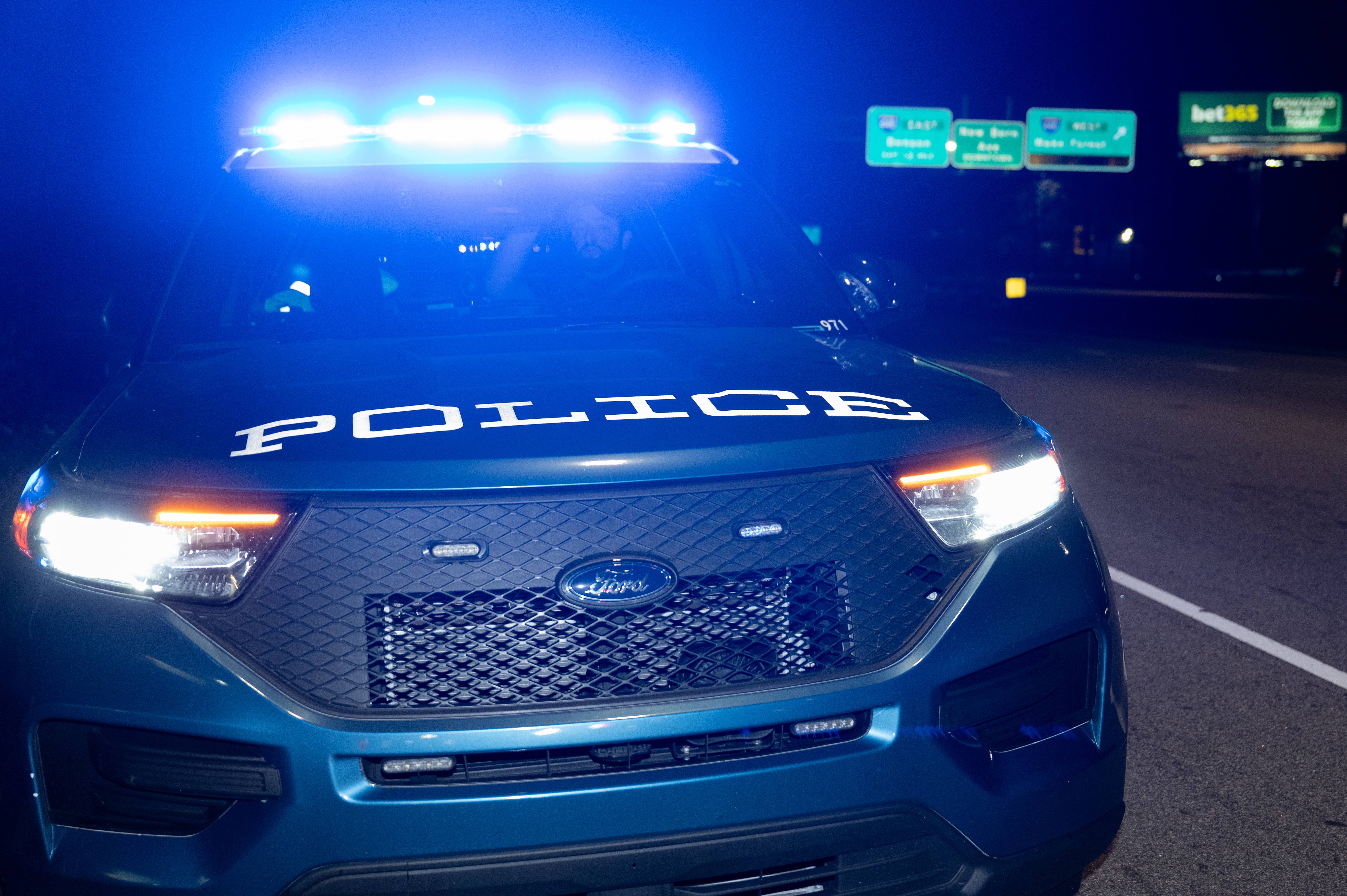 Raleigh police car with sirens flashing