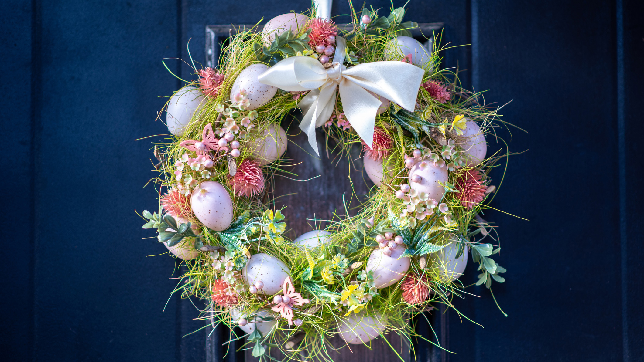 a wreath with a spring theme and pastel colors
