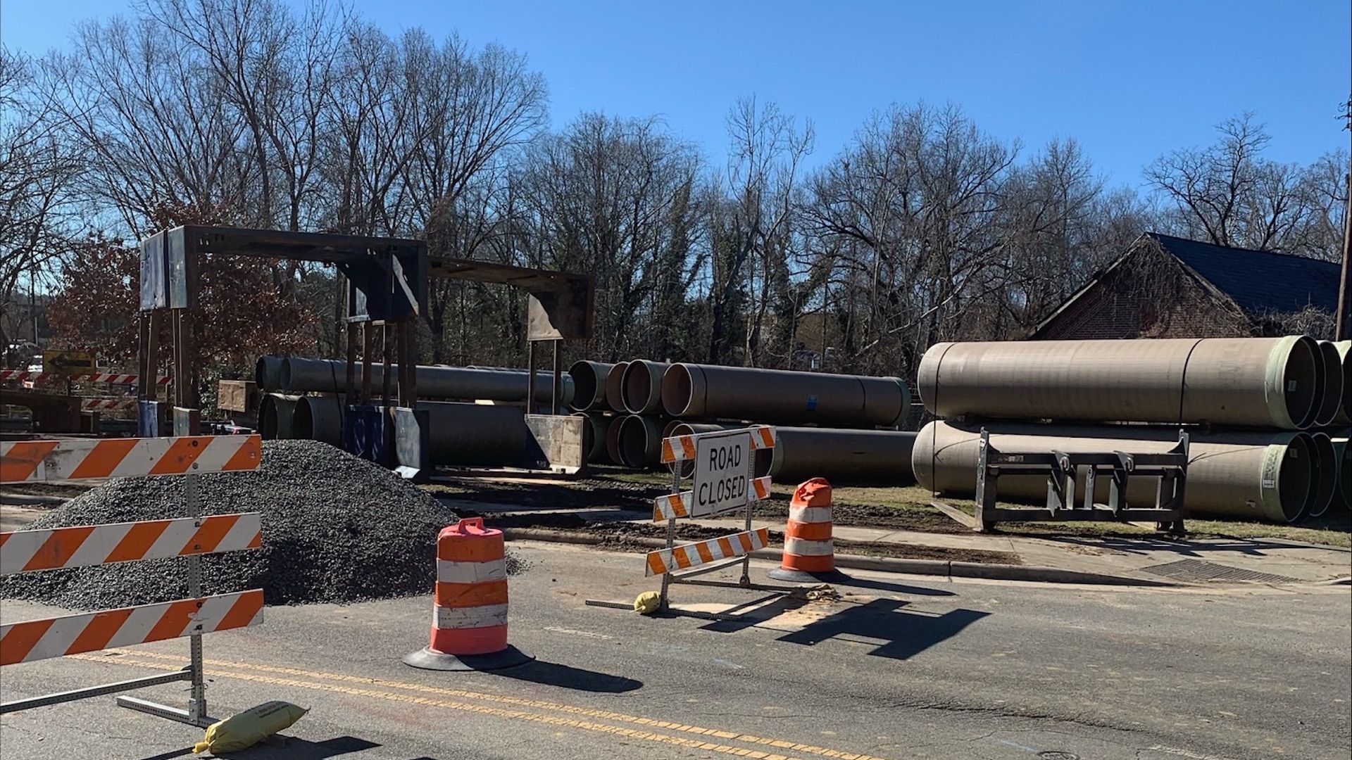 Metal pipes on asphalt road
