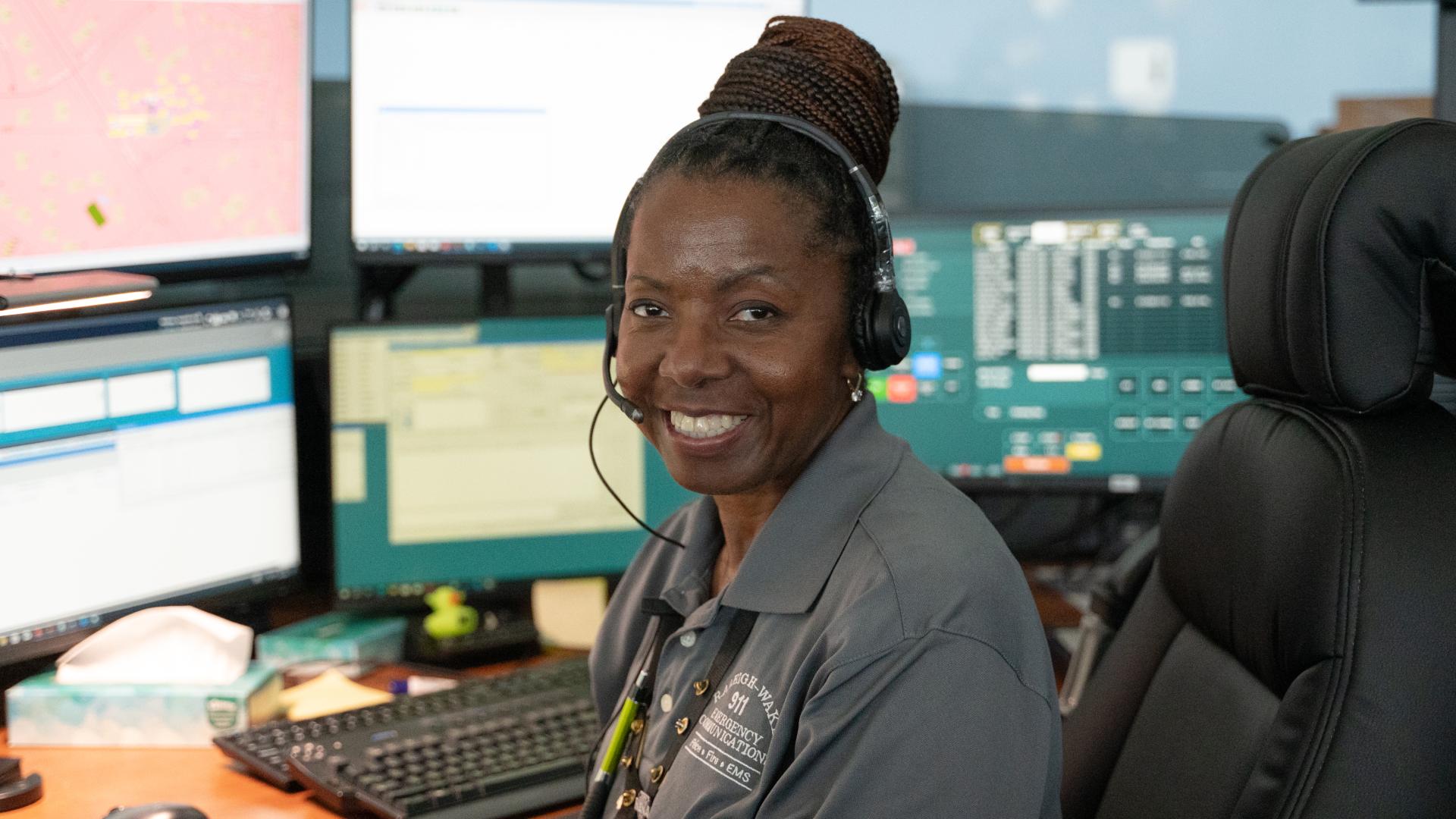 A 9-1-1 operator smiling