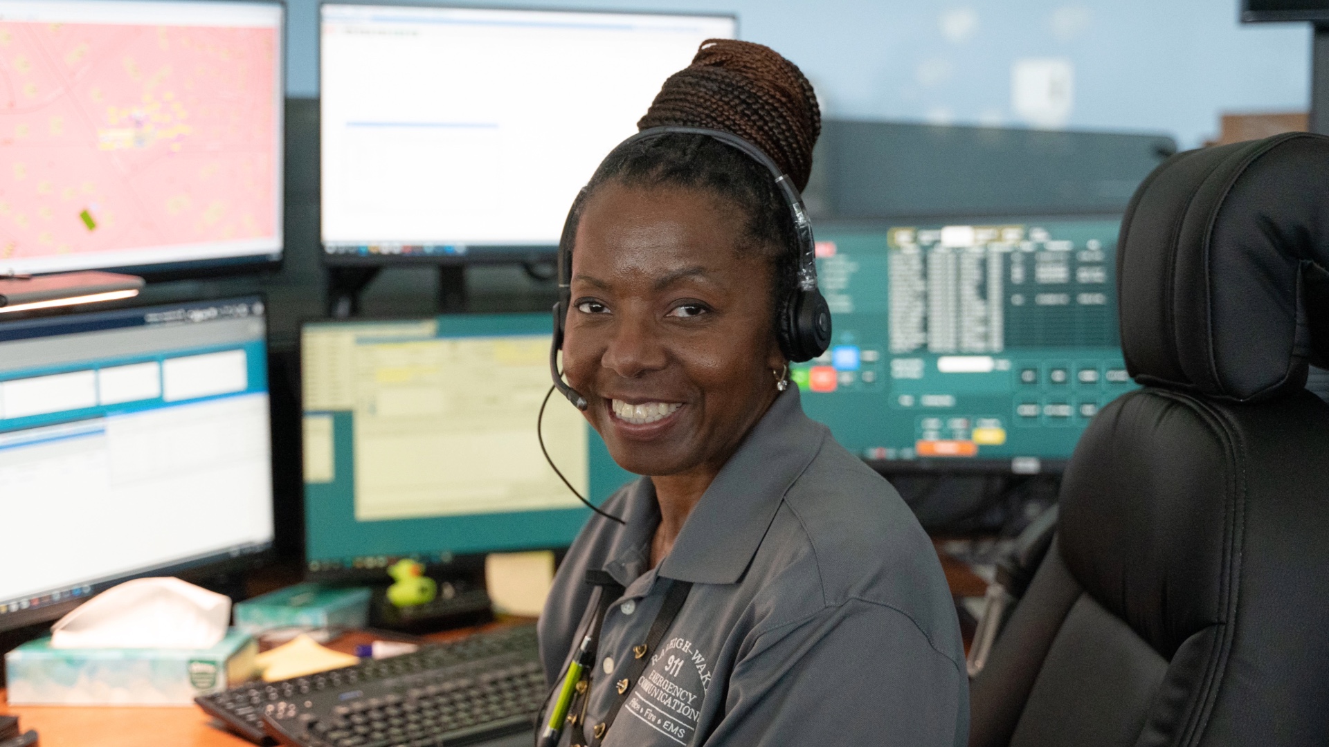 Employee smiling at desk
