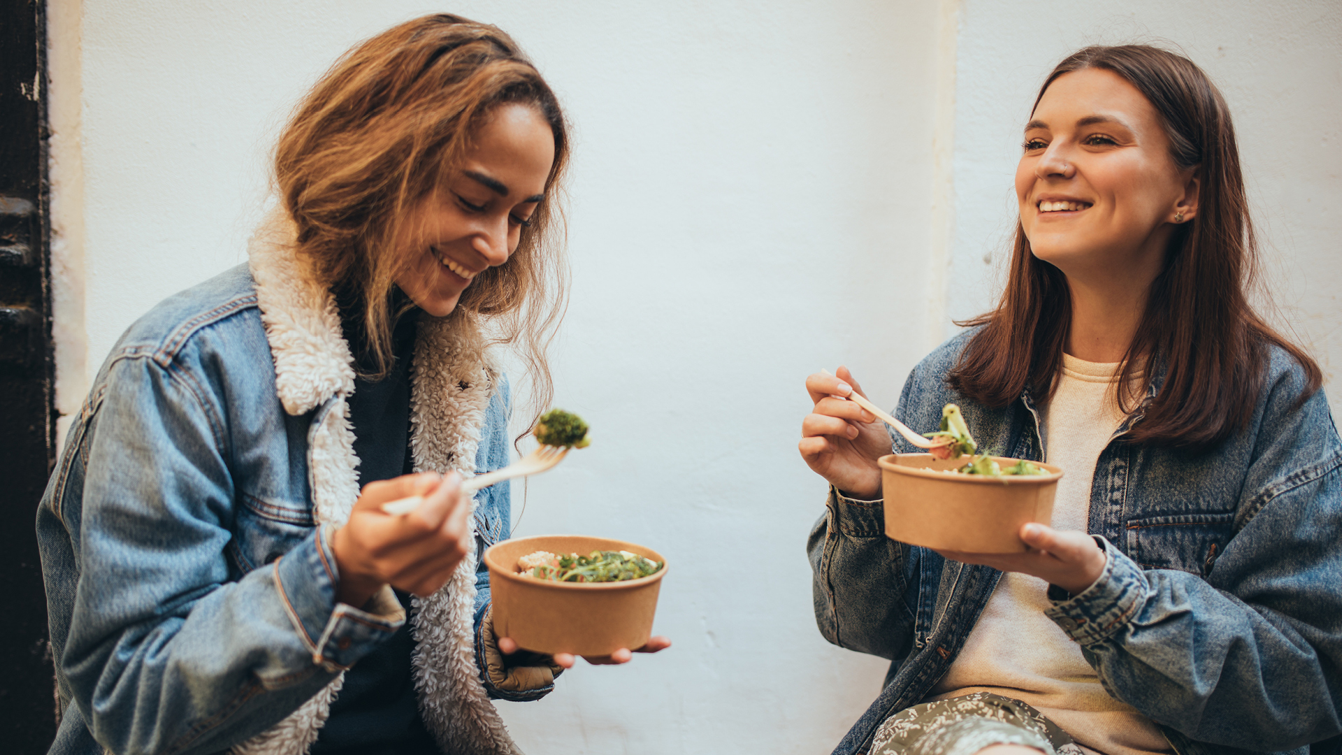 Two people eating food.