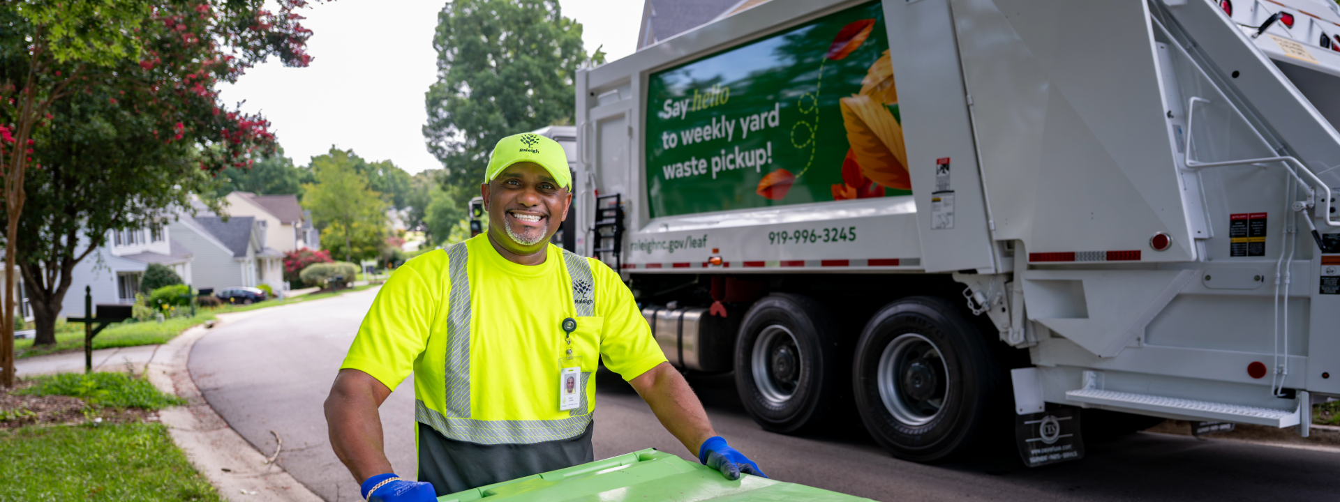 Solid Waste Services employee and trash pick up truck