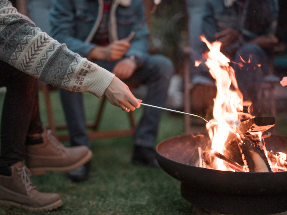 Roasting marshmallows over open fire