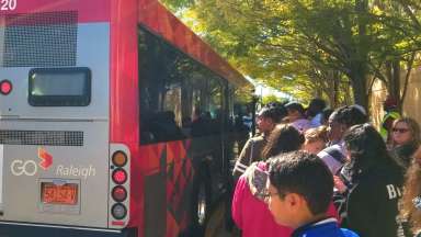 People in line to get on GoRaleigh bus