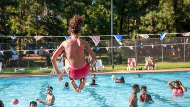 Girl cannonballs into pool at Biltmore Park