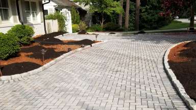 A driveway that made of blocks or washed stoned that allow water to soak into the ground.