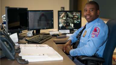 Raleigh Police Officer sitting at front desk to the station