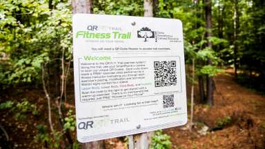 QR Fitness Trail sign on the trail at Lake Johnson Park